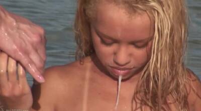 Blonde Beauty Gets Cum In Her Mouth In This Hot Threesome On The Beach on freereelz.com