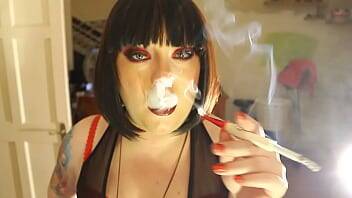 Fat Domme Tina Smua Smokes A Filterless Cigarette In A Holder - Britain on freereelz.com