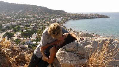 Beautiful Teen Couple In Love Passionately Kissing Above The Sea On Crete Island on freereelz.com