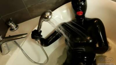 Sexy Black Rubberdoll In Bath on freereelz.com