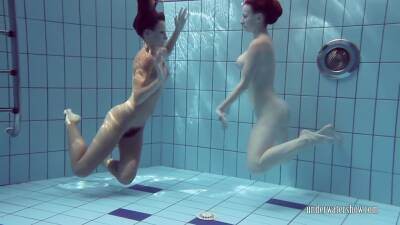 Katrin Swims And Strips Lucy In The Swimming Pool on freereelz.com