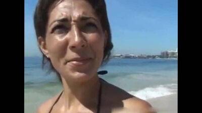 Tanned cougar was picked up on a public beach for kinky sex and a facial - Germany - Brazil on freereelz.com