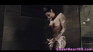 Inked les milf eaten out in the shower on freereelz.com