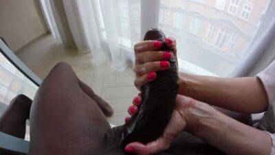 A petite blonde plays with the foreskin of a huge black cock. on freereelz.com