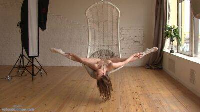 Flexible Beauty Ballerina Playfully Poses For Me In A Hanging Chair, Moving Her Long Legs Wide. 4 Of 6 on freereelz.com