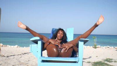 Ebony Latin Girl, Oil Skin And Public Orgasm On The Beach on freereelz.com