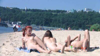 Wicked young nudist enjoys being topless at the beach on freereelz.com