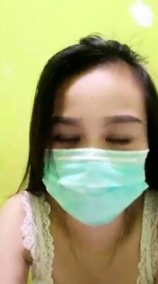 Playful Indonesian hottie wears a facemask while rubbing - Indonesia on freereelz.com