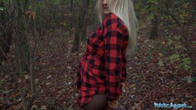 Beautiful Busty Blonde takes her clothes off in the woods before fucking on freereelz.com