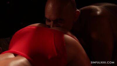 MILF in red lingerie against two muscular machos on freereelz.com