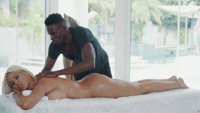 African masseur fucks his big tits bimbo client on the table on freereelz.com