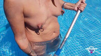 Nippleringlover Horny Milf Nude Cleaning The Pool Extreme Stretched Pierced Nipples on freereelz.com