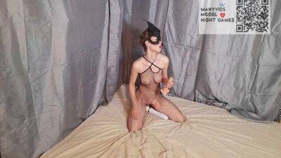 Girl In A Mask And A Mesh On The Body Sucks And Fucks A Dildo on freereelz.com