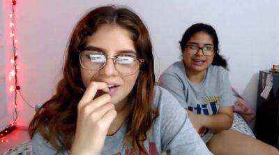 Two nerdy latinas playing with their pussies on cam on freereelz.com