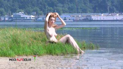 Playful blond nudist teen caught on camera naked at the beach on freereelz.com