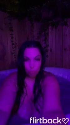 Brunnette flashing her boobs at the hot tub on freereelz.com