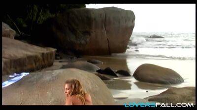 Stripteasing beach blonde anal babe on freereelz.com