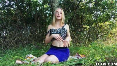 Beautiful young girl outdoor masturbating her pussy in the woods in a clearing on freereelz.com