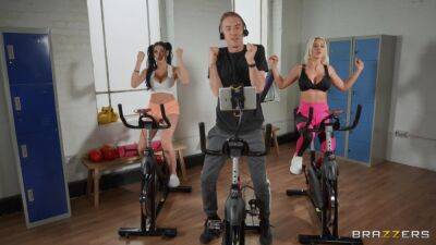 Sporty bitches get intimate during spinning class and devour the same cock together on freereelz.com