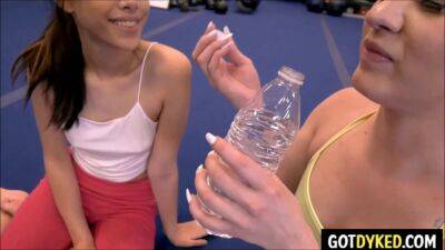 Petite yoga babe with small tits enjoys intense lesbian sex in a gym session on freereelz.com