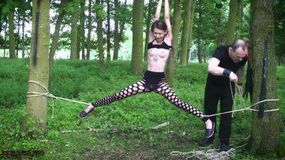 Submissive teen tied up in the woods on freereelz.com