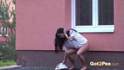 Brunette hottie pees in public while getting her shaved pussy soaked - Czech Republic on freereelz.com