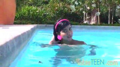 Tobie teen masturbating outdoors by the pool on freereelz.com