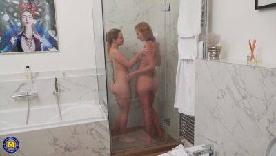 Mature star Effie Gold enjoys a steamy lesbian shower with Karry on freereelz.com