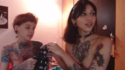 Two girls with tattoos show what they can do with hot pussy on freereelz.com