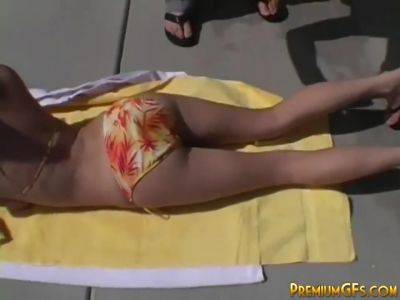 Stripteasing teen hottie catches some rays on freereelz.com