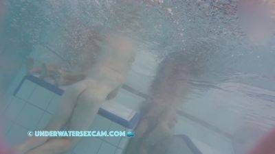 This Young Couple Plays Together Underwater In Front Of Many People on freereelz.com