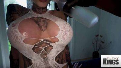 Inked Blonde with Huge Breasts Gets Oiled Up and Fucked on freereelz.com