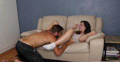 Cute brunette shares moments of lustful passion on the couch on freereelz.com